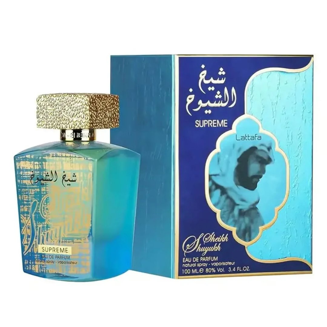 Lattafa Sheikh Al Shuyukh Supreme by Lattafa 100ml — A blue and green faceted glass perfume bottle with a gold textured cap sits next to its blue and light blue patterned box, which features an image of a man in traditional headwear. | Lattafa Sheikh Al Shuyukh Supreme by Lattafa 100ml — Botol kaca berfaset biru dan