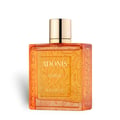 Rayhaan Adonis Icarus Perfume — A gold embossed box sits next to a square amber glass perfume bottle with a gold cap, both featuring intricate embossed patterns. | Rayhaan Adonis Icarus Perfume — Kotak emas bertekstur duduk bersebelahan botol minyak wangi kaca berwarna ambar berbentuk segi empat dengan penutup emas