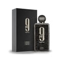 Afnan 9 PM Night Out Extrait de Parfum — A black textured perfume bottle with a dark textured cap stands next to its matching black textured box, both featuring a large white '9 PM Night Out' logo. | Afnan 9 PM Night Out Extrait de Parfum — Botol minyak wangi bertekstur hitam dengan penutup bertekstur gelap berdiri di