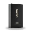 Afnan 9 PM Night Out Extrait de Parfum — A black textured perfume bottle with a dark textured cap stands next to its matching black textured box, both featuring a large white '9 PM Night Out' logo. | Afnan 9 PM Night Out Extrait de Parfum — Botol minyak wangi bertekstur hitam dengan penutup bertekstur gelap berdiri di