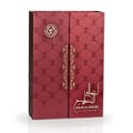 Ard Al Zaafaran Ahlam Al Khaleej 80ml by Ard Al Zaafaran — A red perfume box with gold intricate patterns and a matching red perfume bottle with a gold cap, displayed side-by-side on a white reflective surface. | Ard Al Zaafaran Ahlam Al Khaleej 80ml by Ard Al Zaafaran — Kotak minyak wangi merah dengan corak emas yang