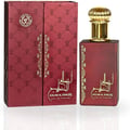 Ard Al Zaafaran Ahlam Al Khaleej 80ml by Ard Al Zaafaran — A red perfume box with gold intricate patterns and a matching red perfume bottle with a gold cap, displayed side-by-side on a white reflective surface. | Ard Al Zaafaran Ahlam Al Khaleej 80ml by Ard Al Zaafaran — Kotak minyak wangi merah dengan corak emas yang