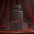 Zimaya Al Embratur Absolu Eau De Parfum 100ml by Zimaya — Black perfume bottle and box with intricate grey patterns and red Arabic calligraphy | Zimaya Al Embratur Absolu Eau De Parfum 100ml by Zimaya — Botol dan kotak minyak wangi hitam dengan corak kelabu rumit dan kaligrafi Arab merah