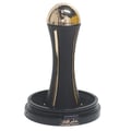 Lattafa Pride Al Khas Winners Trophy Gold 100ml — A black perfume box with gold Arabic and English text, and a gold-capped black perfume bottle shaped like an hourglass, displayed on a white background. | Lattafa Pride Al Khas Winners Trophy Gold 100ml — Kotak minyak wangi hitam dengan teks Arab dan Inggeris emas, dan