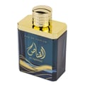 Ard Al Zaafaran Al Qannas Eau De Parfum 100ml — A blue perfume bottle and its matching blue box with gold Arabic calligraphy and wavy lines, displayed side-by-side on a white background. | Ard Al Zaafaran Al Qannas Eau De Parfum 100ml — Botol minyak wangi biru dan kotak birunya yang sepadan dengan kaligrafi Arab emas