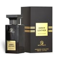 Grandeur Amber Leather 100ml by Grandeur Perfumes — A dark glass perfume bottle with a gold label sits next to its black and gold striped box on a white background. | Grandeur Amber Leather 100ml oleh Grandeur Perfumes — Botol minyak wangi kaca gelap dengan label emas duduk di sebelah kotaknya yang berjalur hitam dan