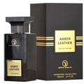Grandeur Amber Leather 100ml by Grandeur Perfumes — A dark glass perfume bottle with a gold label sits next to its black and gold striped box on a white background. | Grandeur Amber Leather 100ml oleh Grandeur Perfumes — Botol minyak wangi kaca gelap dengan label emas duduk di sebelah kotaknya yang berjalur hitam dan