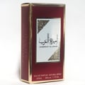 Ard Al Zaafaran Ameerat Al Arab Princess of Arabia 50ml — A red and gold perfume box stands next to a clear glass perfume bottle with a gold cap and a red label. | Ard Al Zaafaran Ameerat Al Arab Princess of Arabia 50ml — Kotak minyak wangi merah dan emas berdiri di sebelah botol minyak wangi kaca jernih dengan