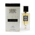Lattafa Ana Abiyedh Leather 60ml by Lattafa Perfumes — A white perfume box with gold Arabic calligraphy and a clear glass bottle with gold accents and a dark brown cap, displayed side-by-side. | Lattafa Ana Abiyedh Leather 60ml by Lattafa Perfumes — Kotak minyak wangi putih dengan kaligrafi Arab emas dan botol kaca