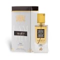 Lattafa Ana Abiyedh Leather 60ml by Lattafa Perfumes — A white perfume box with gold Arabic calligraphy and a clear glass bottle with gold accents and a dark brown cap, displayed side-by-side. | Lattafa Ana Abiyedh Leather 60ml by Lattafa Perfumes — Kotak minyak wangi putih dengan kaligrafi Arab emas dan botol kaca