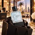 French Avenue Arsh Black Ice — Clear glass perfume bottle with light blue liquid, black studded cap, and black base with "FRENCH AVENUE" embossed.