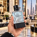 French Avenue Arsh Black Ice — Clear glass perfume bottle with light blue liquid, black studded cap, and black base with "FRENCH AVENUE" embossed.