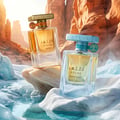Lattafa Atlas Glacial Valley — A light blue textured box stands next to a clear glass perfume bottle with a light yellow liquid. The box has green vertical stripes and a tree graphic. The bottle has a teal cap with a tree charm.