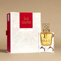 Lattafa Aura Lattafa 60ml EDP — A white and red box with gold line art is displayed next to a clear glass perfume bottle with a gold patterned cap, both featuring the Lattafa Aura branding. | Lattafa Aura Lattafa 60ml EDP — Kotak putih dan merah dengan seni garis emas dipamerkan di sebelah botol minyak wangi kaca