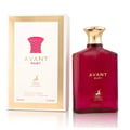 Maison Alhambra Avant Ruby Eau De Parfum 100ml — A bright pink glass perfume bottle with a gold textured cap stands next to its white and gold patterned box, both featuring the Avant Ruby branding and a deer logo. | Maison Alhambra Avant Ruby Eau De Parfum 100ml — Botol kaca berwarna merah jambu terang dengan penutup
