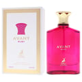 Maison Alhambra Avant Ruby Eau De Parfum 100ml — A bright pink glass perfume bottle with a gold textured cap stands next to its white and gold patterned box, both featuring the Avant Ruby branding and a deer logo. | Maison Alhambra Avant Ruby Eau De Parfum 100ml — Botol kaca berwarna merah jambu terang dengan penutup