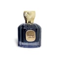 Maison Alhambra Baroque Satin Oud 100ml — A dark glass perfume bottle with a gold textured cap sits next to its matching dark box with gold geometric patterns. | Maison Alhambra Baroque Satin Oud 100ml — Botol minyak wangi kaca gelap dengan penutup bertekstur emas terletak di sebelah kotak gelapnya dengan corak