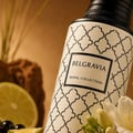 Maison Asrar Belgravia by Maison Asrar Eau de Parfum — A cream-colored perfume bottle with a black patterned design and a black textured cap, featuring a black label with white text 'BELGRAVIA ROYAL COLLECTION'.