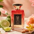 Bujairami Blush Eau de Parfum — Red box and glass bottle with gold cap and red liquid, black label with gold crown and B logo