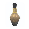 Grandeur Cashmere Luxe 100ml by Grandeur — A faceted glass perfume bottle with a black gem-like cap and a black tassel hanging from the neck, against a white background. | Grandeur Cashmere Luxe 100ml by Grandeur — Botol kaca berfaset dengan penutup seperti permata hitam dan juntai hitam tergantung di lehernya
