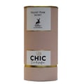 Maison Alhambra Chic Velvet Pink Secret for Women 100ml — A pink cylindrical box stands next to a clear glass perfume bottle with a black cap and gold accents. The box and bottle label feature a deer silhouette and text. | Maison Alhambra Chic Velvet Pink Secret for Women 100ml — Kotak silinder merah jambu berdiri di