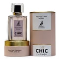 Maison Alhambra Chic Velvet Pink Secret for Women 100ml — A pink cylindrical box stands next to a clear glass perfume bottle with a black cap and gold accents. The box and bottle label feature a deer silhouette and text. | Maison Alhambra Chic Velvet Pink Secret for Women 100ml — Kotak silinder merah jambu berdiri di