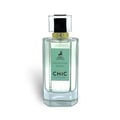 Maison Alhambra Chic Velvet Vert Secret 100ml — A cylindrical light green box with gold trim stands next to a clear glass perfume bottle with a green label and a silver and black cap. | Maison Alhambra Chic Velvet Vert Secret 100ml — Kotak silinder hijau muda dengan trim emas berdiri di sebelah botol minyak wangi kaca