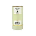Maison Alhambra Chic Velvet Vert Secret 100ml — A cylindrical light green box with gold trim stands next to a clear glass perfume bottle with a green label and a silver and black cap. | Maison Alhambra Chic Velvet Vert Secret 100ml — Kotak silinder hijau muda dengan trim emas berdiri di sebelah botol minyak wangi kaca