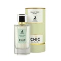 Maison Alhambra Chic Velvet Vert Secret 100ml — A cylindrical light green box with gold trim stands next to a clear glass perfume bottle with a green label and a silver and black cap. | Maison Alhambra Chic Velvet Vert Secret 100ml — Kotak silinder hijau muda dengan trim emas berdiri di sebelah botol minyak wangi kaca