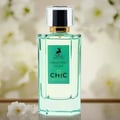 Maison Alhambra Chic Velvet Vert Secret 100ml — A cylindrical light green box with gold trim stands next to a clear glass perfume bottle with a green label and a silver and black cap. | Maison Alhambra Chic Velvet Vert Secret 100ml — Kotak silinder hijau muda dengan trim emas berdiri di sebelah botol minyak wangi kaca