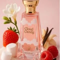 Khadlaj Cloud Candy Eau De Parfum 100ml — A pink perfume box with cloud graphics sits next to a clear glass perfume bottle with cloud-like white accents and a gold cap, both featuring the 'Cloud Candy' logo. | Khadlaj Cloud Candy Eau De Parfum 100ml — Kotak minyak wangi merah jambu dengan grafik awan duduk di sebelah
