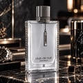Armaf Club de Nuit Precieux II — Black textured box with silver text and a clear glass perfume bottle with a silver chain and charm.