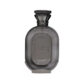 Zimaya Daiman Eclipse Eau De Parfum 100ml — A dark grey perfume bottle with a textured body and a metallic cap stands next to its matching dark grey box with Arabic calligraphy and text. | Zimaya Daiman Eclipse Eau De Parfum 100ml — Botol minyak wangi kelabu gelap dengan badan bertekstur dan penutup logam berdiri