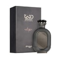 Zimaya Daiman Eclipse Eau De Parfum 100ml — A dark grey perfume bottle with a textured body and a metallic cap stands next to its matching dark grey box with Arabic calligraphy and text. | Zimaya Daiman Eclipse Eau De Parfum 100ml — Botol minyak wangi kelabu gelap dengan badan bertekstur dan penutup logam berdiri