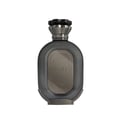 Zimaya Daiman Eclipse Eau De Parfum 100ml — A dark grey perfume bottle with a textured body and a metallic cap stands next to its matching dark grey box with Arabic calligraphy and text. | Zimaya Daiman Eclipse Eau De Parfum 100ml — Botol minyak wangi kelabu gelap dengan badan bertekstur dan penutup logam berdiri