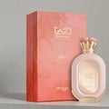 Zimaya Daiman Eden Eau De Parfum 100ml by Zimaya — A pink textured perfume bottle with gold accents stands next to its matching coral-orange textured box with gold marbling. | Zimaya Daiman Eden Eau De Parfum 100ml by Zimaya — Sebotol minyak wangi merah jambu bertekstur dengan perincian emas berdiri di sebelah kotak