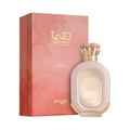 Zimaya Daiman Eden Eau De Parfum 100ml by Zimaya — A pink textured perfume bottle with gold accents stands next to its matching coral-orange textured box with gold marbling. | Zimaya Daiman Eden Eau De Parfum 100ml by Zimaya — Sebotol minyak wangi merah jambu bertekstur dengan perincian emas berdiri di sebelah kotak