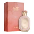 Zimaya Daiman Eden Eau De Parfum 100ml by Zimaya — A pink textured perfume bottle with gold accents stands next to its matching coral-orange textured box with gold marbling. | Zimaya Daiman Eden Eau De Parfum 100ml by Zimaya — Sebotol minyak wangi merah jambu bertekstur dengan perincian emas berdiri di sebelah kotak