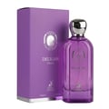 Maison Alhambra Delilah Viola 100ml — A purple glass perfume bottle with a gold cap stands next to its matching purple box, both featuring gold embossed details and a deer logo. | Maison Alhambra Delilah Viola 100ml — Botol kaca ungu berdiri di sebelah kotak ungu sepadan, kedua-duanya menampilkan butiran emas timbul