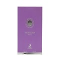 Maison Alhambra Delilah Viola 100ml — A purple glass perfume bottle with a gold cap stands next to its matching purple box, both featuring gold embossed details and a deer logo. | Maison Alhambra Delilah Viola 100ml — Botol kaca ungu berdiri di sebelah kotak ungu sepadan, kedua-duanya menampilkan butiran emas timbul