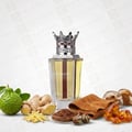 Lattafa Dynasty Lattafa 100ml EDP Unisex — A maroon textured box with a white ornate crest sits next to a clear glass perfume bottle topped with a silver crown-shaped cap with red accents.
