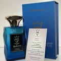 Bujairami Enforcer Eau de Parfum — Blue faceted glass bottle with gold cap next to blue box with gold logo