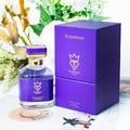 Bujairami Executor by Bujairami 100ml Extrait de Parfum — Purple bottle with gold accents and jeweled cap next to a matching