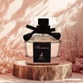 Maison Alhambra Florenza 100ml Maison Alhambra Florence — A perfume bottle and its box are displayed against a white background. The box has a floral design and the bottle is octagonal with a black ribbon. | Maison Alhambra Florenza 100ml Maison Alhambra Florence — Botol minyak wangi dan kotaknya dipamerkan berlatar