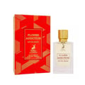 Maison Alhambra Flower Addiction Edition Rouge 100ml — A red and black perfume box stands next to a clear glass perfume bottle with a gold textured cap and a deer logo. | Maison Alhambra Flower Addiction Edition Rouge 100ml — Kotak pewangi merah dan hitam berdiri di sebelah botol pewangi kaca jernih dengan penutup