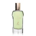 Maison Alhambra Glacier Heaven 100ml — Green floral patterned cylindrical box and a clear glass perfume bottle with green liquid and gold cap, set against a white background. | Maison Alhambra Glacier Heaven 100ml — Kotak silinder hijau bermotif bunga dan botol minyak wangi kaca jernih dengan cecair hijau dan penutup