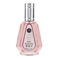 Ard Al Zaafaran Hareem Al Sultan EDP 50ml — A pink perfume bottle with a silver cap and a patterned label sits next to its matching pink and gold patterned box with a circular purple design. | Ard Al Zaafaran Hareem Al Sultan EDP 50ml — Sebotol minyak wangi merah jambu dengan penutup perak dan label bercorak terletak