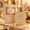 RASASI Hawas Addiction by Rasasi 100ml EDP — Gold bottle and matching box with textured gold panel and Arabic calligraphy.