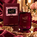 RASASI Hawas Diva by Rasasi 100ml EDP — A deep burgundy perfume bottle with gold accents and the brand name 'HAWAS' in Arabic and English. A matching burgundy box with a pink snakeskin pattern is displayed next to it.