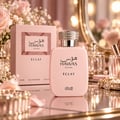 RASASI Hawas Eclat by Rasasi 100ml EDP — Pink perfume box and bottle with Arabic script and 'For Her' text, featuring a textured pattern on the box and a crystal-embellished cap on the bottle.